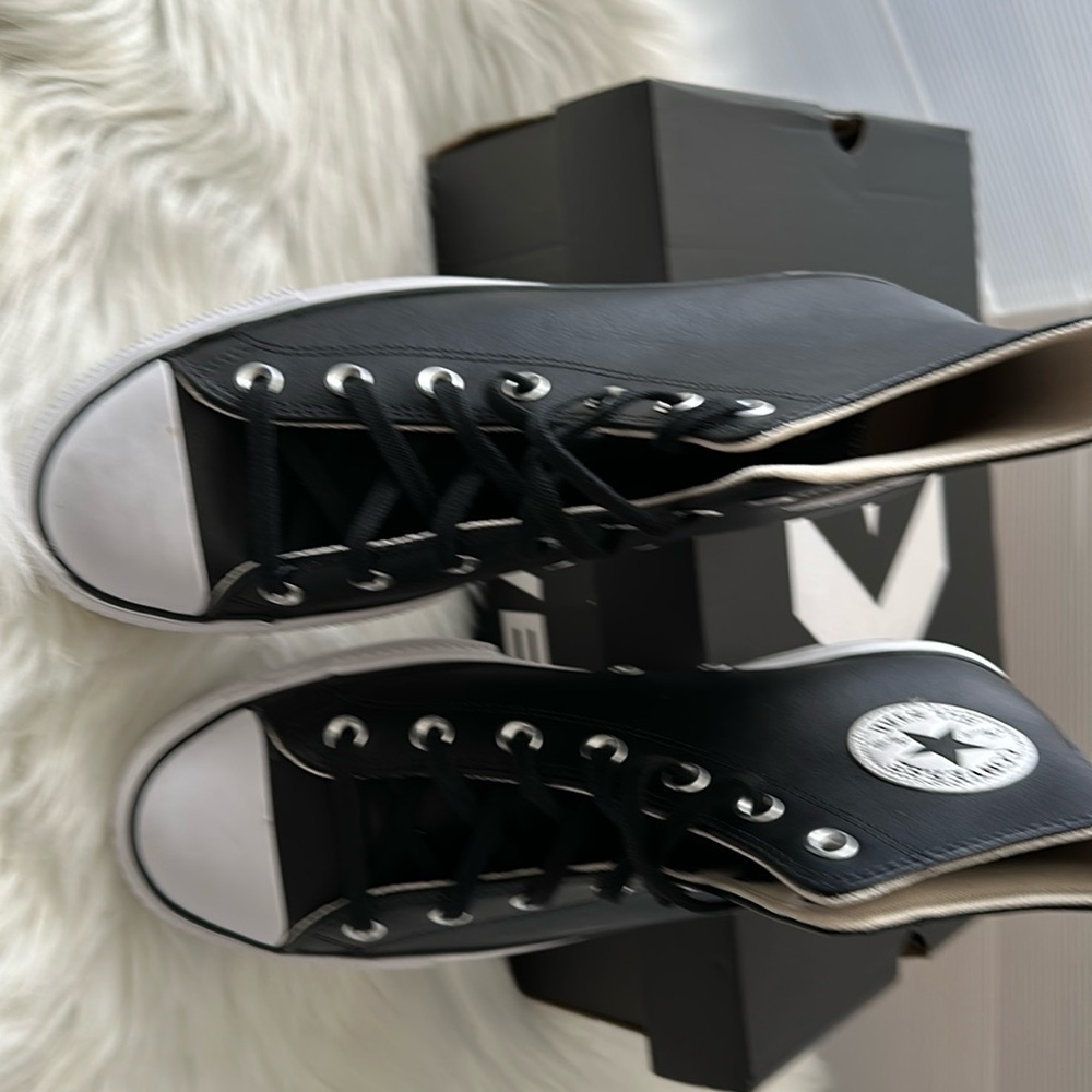New black and white leather converse high tops women’s size 10/men’s size 8.